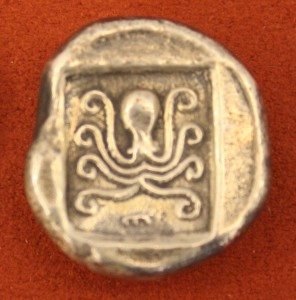 Silver tetradrachm from Eretria Euboea, c. 485 BCE. O: Cow, R: Octopus in incuse square. 