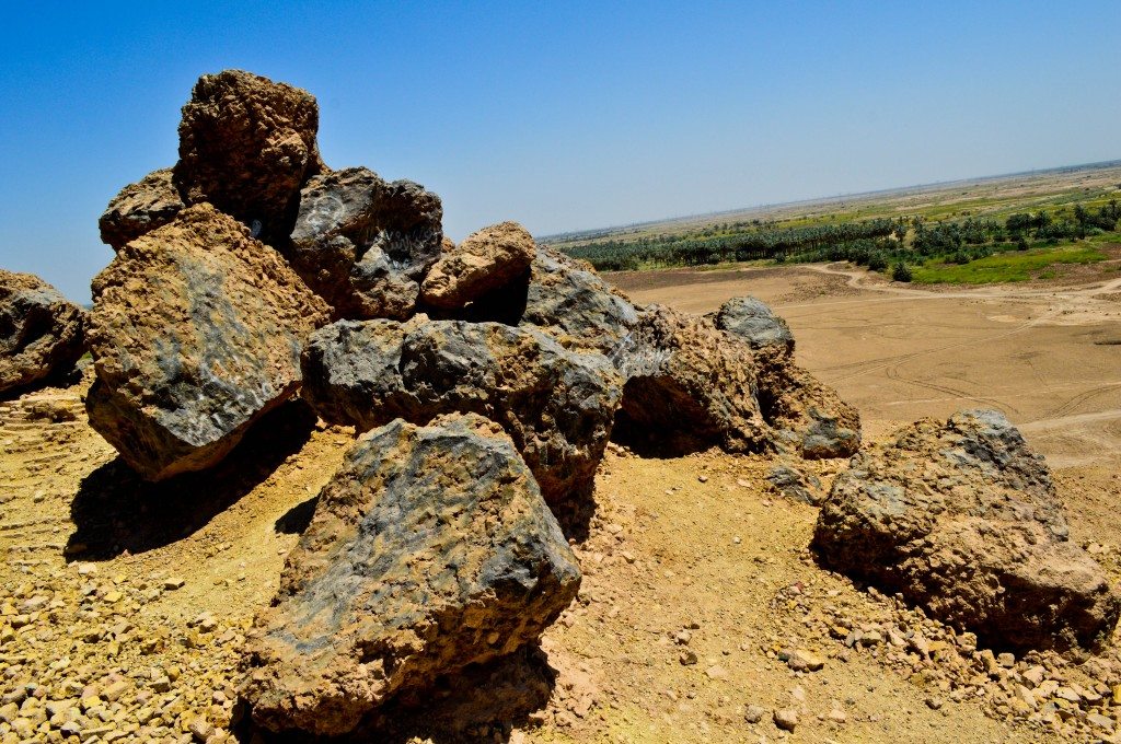 These large rock-like conglomerates of mud-bricks, bitumen, and reed are likely the result of a hot fire and subsequent combustion. The ziggurat was destroyed deliberately by the Achaemenid king Xerxes in 484 BCE. Several of these rock-like structures can be found on the top surface of the ziggurat as well as the surrounding areas. 