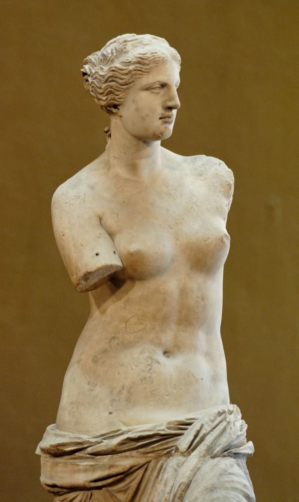 So-called “Venus de Milo” (Aphrodite from Melos). Parian marble, ca. 130-100 BCE. Found in Melos in 1820 CE. On display at the Louvre, Paris. Photo by Jastrow, Public Domain.