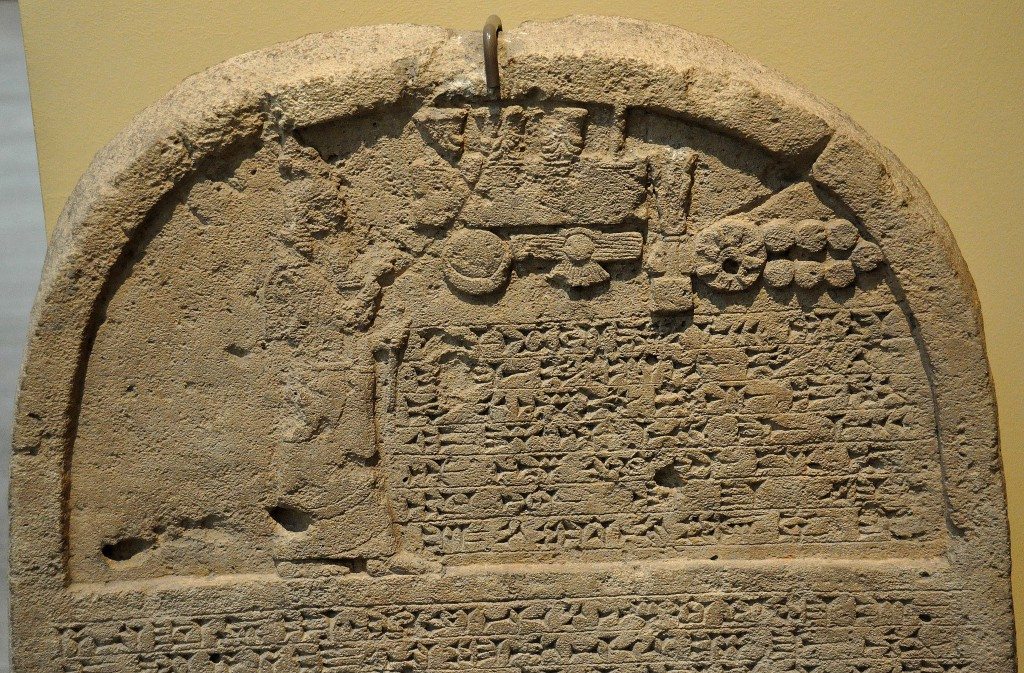 This is the upper par of the limestone stela of Sennacherib, king of Assyrian. The king is praying in front god symbols. From Kuyunjik (modern-day Ninawa Governorate, Iraq). 705-681 BCE. 