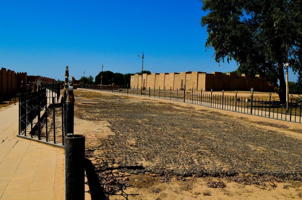 Once you enter the ancient city of Babylon, you will face this. This is the beginning of the Processional Street. The street is surrounded by a fence. The original tiles are still in their places and are covered with bitumen. 