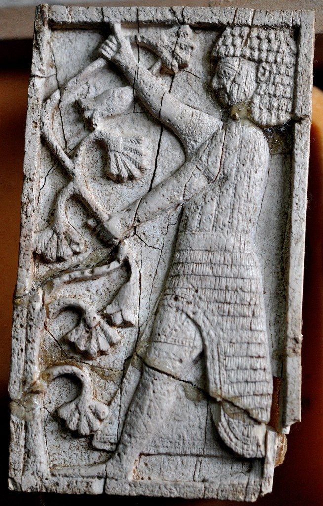 A standing man with an Egyptian appearance holds branches of a lotus tree. Neo-Assyrian period, 9th-7th centuries BCE. From Nimrud, Mesopotamia, Iraq. (The Sulaimaniya Museum, Iraq). 