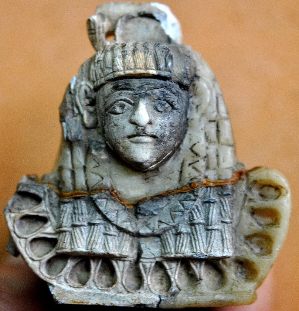 Carved ivory plaque of an Egyptian-looking woman. Note the black burn marks. Neo-Assyrian period, 9th-7th centuries BCE. From Nimrud, Mesopotamia, Iraq. (The Sulaimaniya Museum, Iraq). 