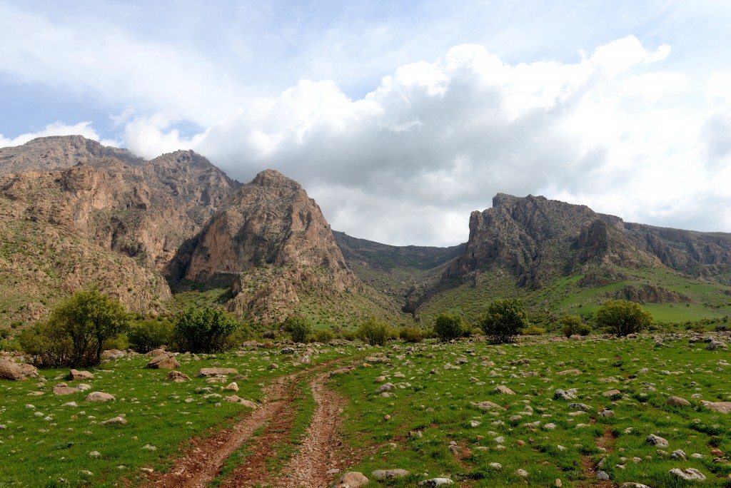 Mountain Rabana (left) and Mountain Merquli (right). The rock-relief of Rabana lies within the valley of the Mountain while the rock-relief of Merquli lies on the summit of the Mountain. Qarachtan village lies behind me by approximately 3 Km. 