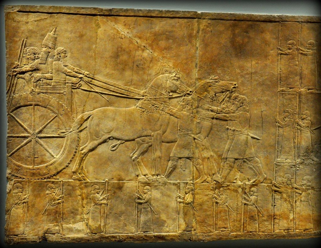 Assyrian Lion. In this alabaster bas-relief, the Assyrian king ashurbanipal stands in his royal chariot while his men do the necessary preparations before the hunt starts. He holds a long spear. From Room C of the North Palace, Nineveh (modern-day Kouyunjik, Mosul Governorate), Mesopotamia, Iraq. Circa 645-535 BCE. The British Museum, London. Photo©Osama S.M. Amin. 