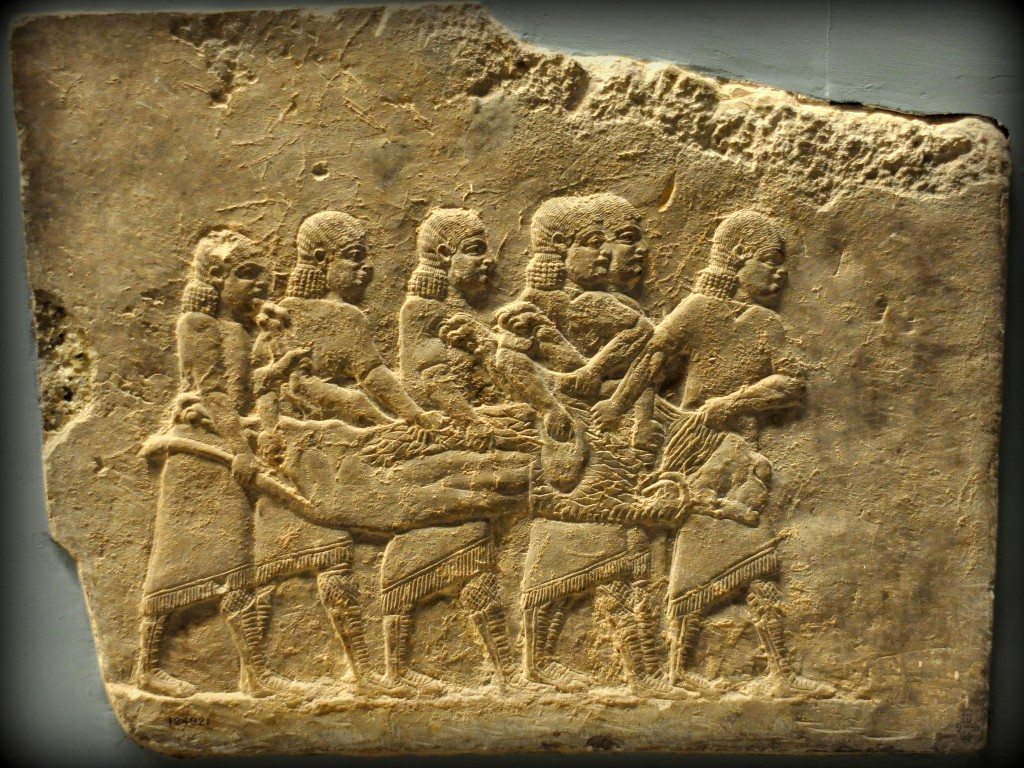 Alabaster bas-relief showing 6 men carrying a dead lion at the end of the hunt. From Room C of the North Palace, Nineveh (modern-day Kouyunjik, Mosul Governorate), Mesopotamia, Iraq. Circa 645-535 BCE. The British Museum, London. Photo©Osama S.M. Amin. 