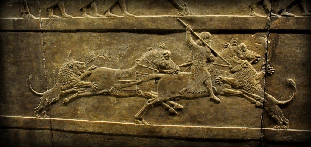 Alabaster bas-relief showing Ashurbanipal thrusting a spear onto a lion's head. This is one of the very anxious moments which was carefully conveyed to us by the artist! The register is part of 3 relatively small-scale registers. The king's spare horse was attacked by a wounded lion that has been left for dead. The king himself is busy with another furiously attacking lion. The king's attendants (not shown in this picture) lagged behind and galloped desperately to rescue their king (from the left side of the panel). The sculptor used empty spaces (before and behind the king) to dramatic effect, one of the features that sets Ashurbanipal's hunt scenes apart from the general run of Assyrian sculpture. 