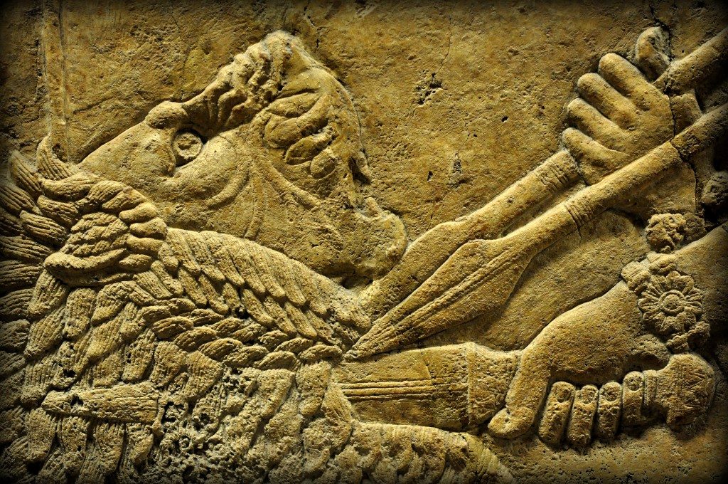 Detail of an alabaster bas-relief showing a lion being stabbed in the neck. The lion has jumped and reached a critical point very close to the king's chariot. The king's attendants thrust their spears onto the lion's neck to stop the lion; the king, using his right hand, stabs the lion deeply into his neck. The lion's painful facial expression was depicted very delicately. From Room C of the North Palace, Nineveh (modern-day Kouyunjik, Mosul Governorate), Mesopotamia, Iraq. Circa 645-535 BCE. The British Museum, London. Photo©Osama S.M. Amin.