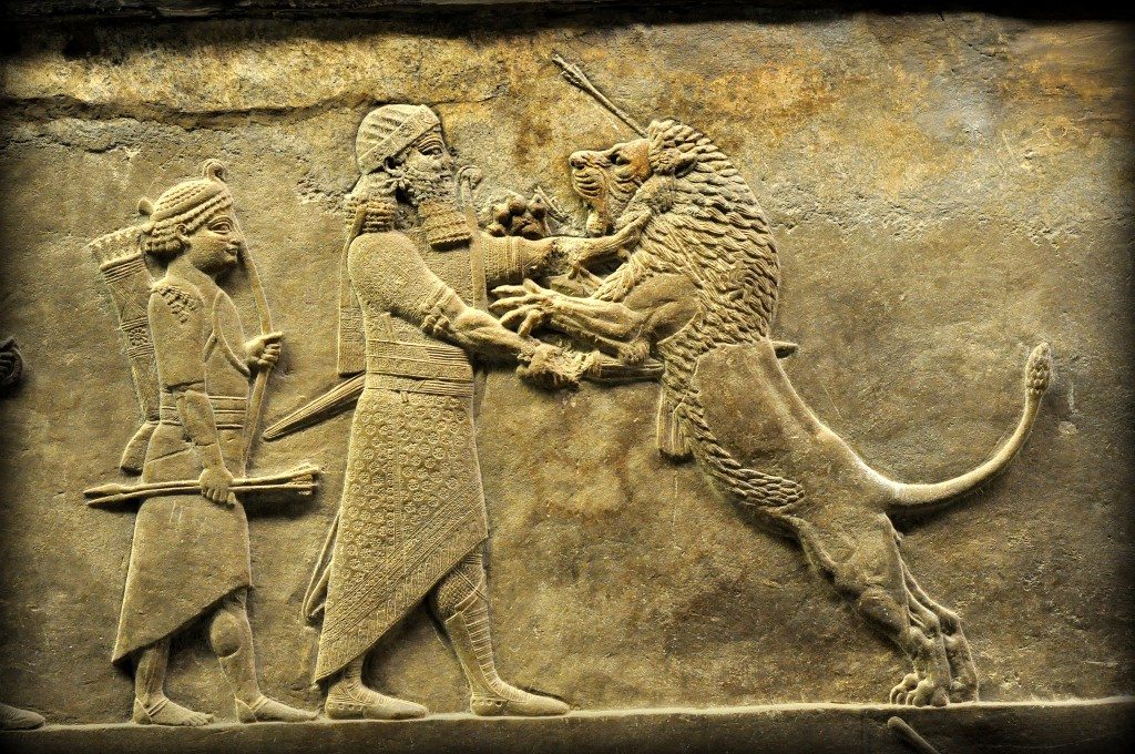 Alabaster bas-relief showing Ashurbanipal stabbing a wounded lion. This is one of the very vivid moments which speaks clearly on its behalf without any narration. The king, on foot, wearing his elegant custom and accessories, grips the lion's neck firmly with his left hand while the right hand stabs a sword rapidly and deeply into the lion's belly. The king, rigid-faced, and the lion, roaring in fear and agony, look at each other. The king's attendant holds a bow and arrows but does not seem to do anything which protects his master; it is somewhat not credible that the king exposed himself to mauling from a slightly wounded but still vigorous and aggressive lion, in the way that this sculpture, viewed in isolation, implies. From Room S of the North Palace, Nineveh (modern-day Kouyunjik, Mosul Governorate), Mesopotamia, Iraq. Circa 645-535 BCE. The British Museum, London. Photo©Osama S.M. Amin. 