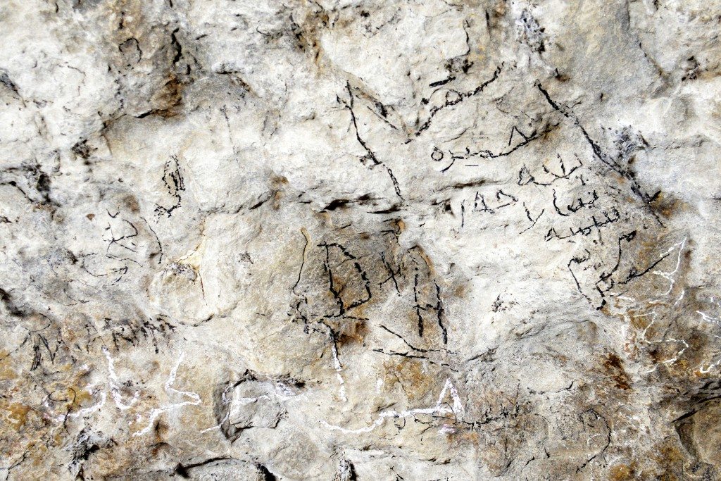 Visitors have left their memories by writing their names (in Kurdish and English letters) on the walls of one of the caves, Ashkawty Tarik. Photo © Osama S. M. Amin.