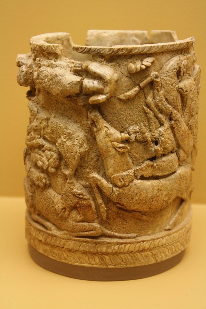 A Greek ivory pyxis depicting griffins attacking stags. 15th Century BCE. (Agora Museum, Athens)