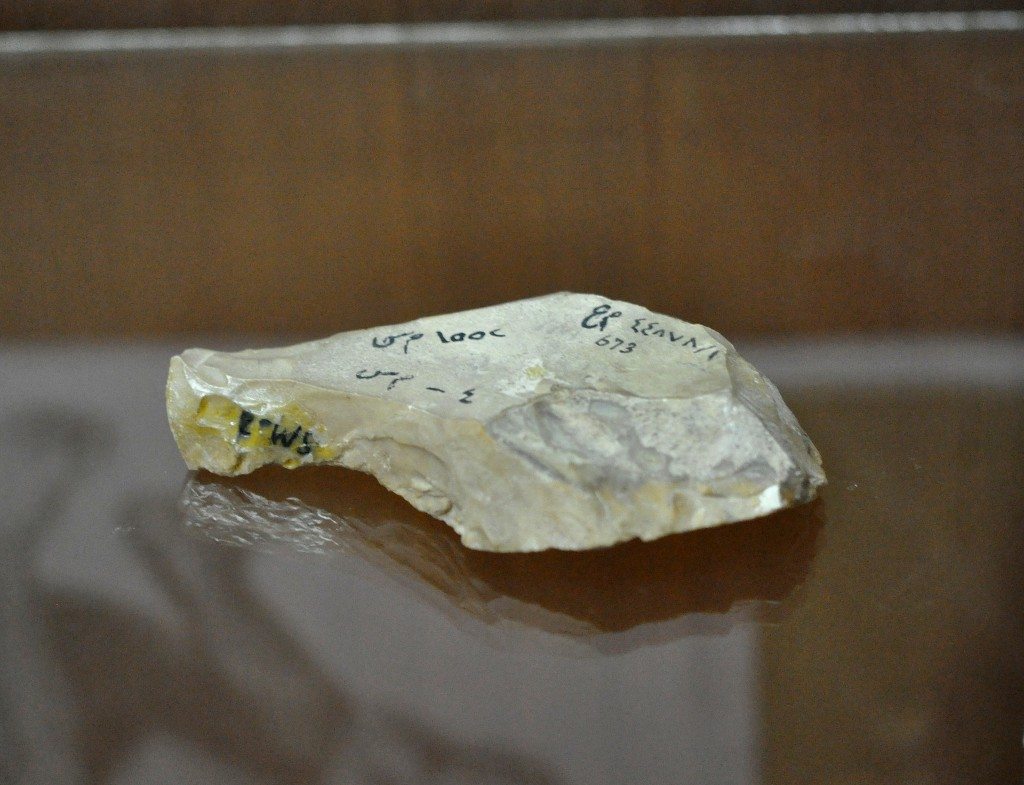 A stone hand-axe dating back to the Paleolithic era that was found at the Hazar Merd cave. It is housed in the Sulaymaniyah Museum, Iraq, in the city near the caves. Photo © Osama S. M. Amin.