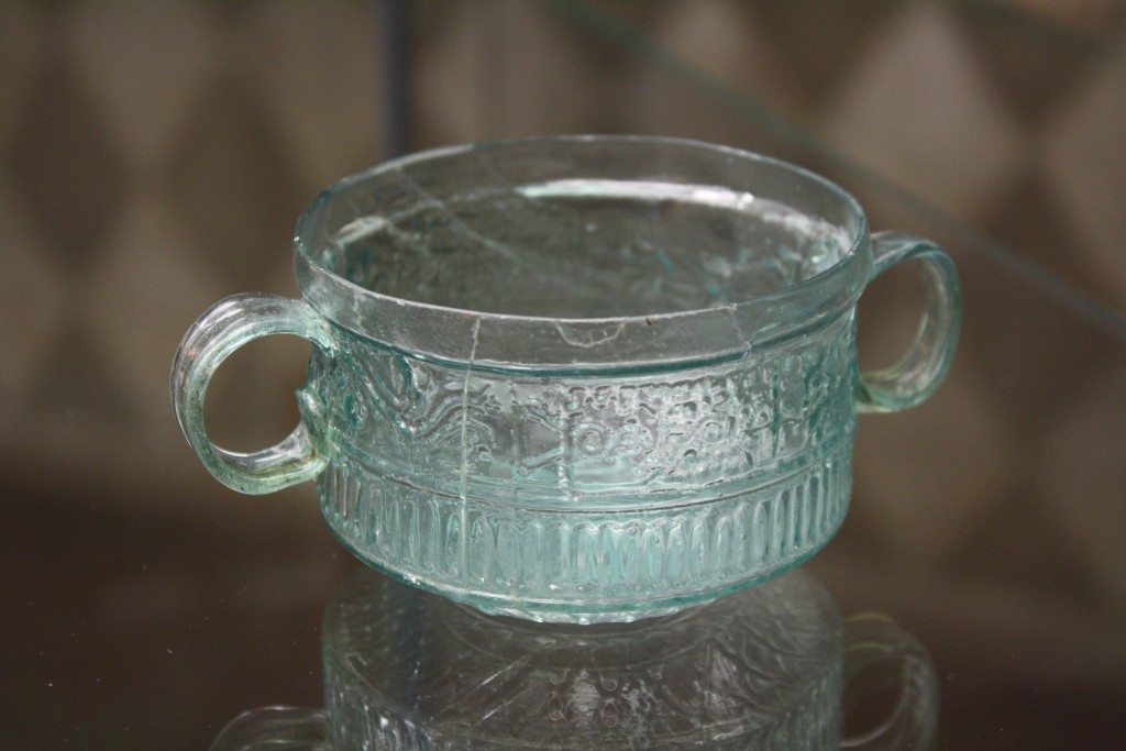 A two-handled cup. Roman glassware at the Archaeological Museum of Pavia. Image © Mark Cartwright.
