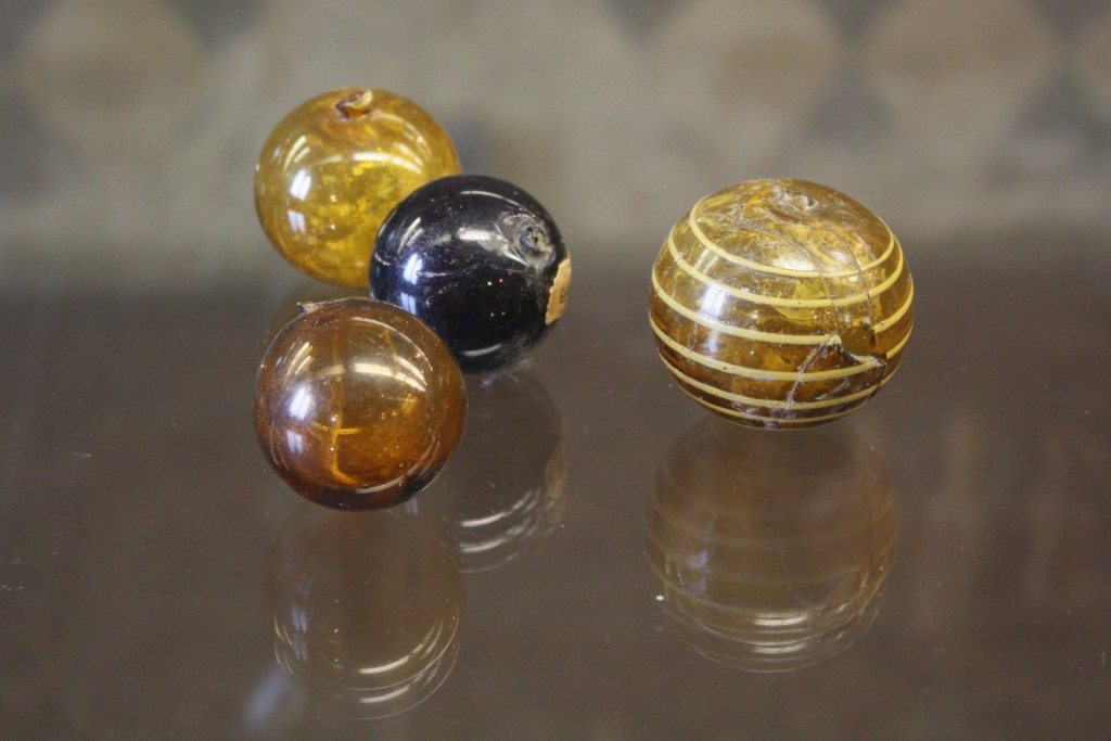Glass perfume spheres. Roman glass at the Archaeological Museum of Pavia. Image © Mark Cartwright.