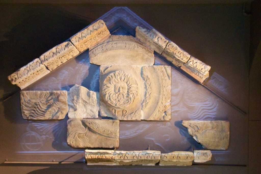 The Gorgon and how it would have fit into the original pediment at the Roman baths. Image © Nick Peel.