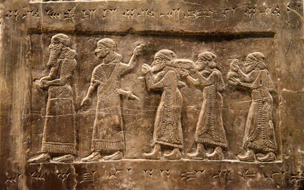 Side B: There are 2 Assyrian officials and 3 tribute-bearers from Israel; they hold “silver, gold ... gold vessels ... tin ...” Photo © Osama S. M. Amin. Black Obelisk of Shalmaneser III.