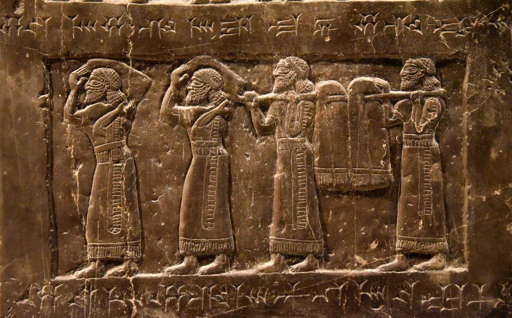 Side B: There are 4 tribute-bearers from Suhu carrying "silver, gold... byssus, garments with multi-colored trim and linen". Photo © Osama S. M. Amin. Black Obelisk of Shalmaneser III.