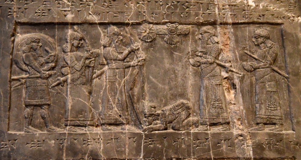 Side A: King Shalmaneser III holds a bow and receives tribute from Sua the Gilzanean. Two attendants stand behind him and he faces his field marshal and another unnamed official. Photo © Osama S. M. Amin. Black Obelisk of Shalmaneser III.