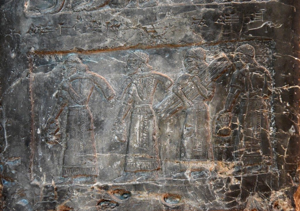 Side D: Four tribute-bearers were depicted carrying "silver, gold, gold pails, ivory [tusks] (and) spears" from the land of Suhu. Photo © Osama S. M. Amin. Black Obelisk of Shalmaneser III.