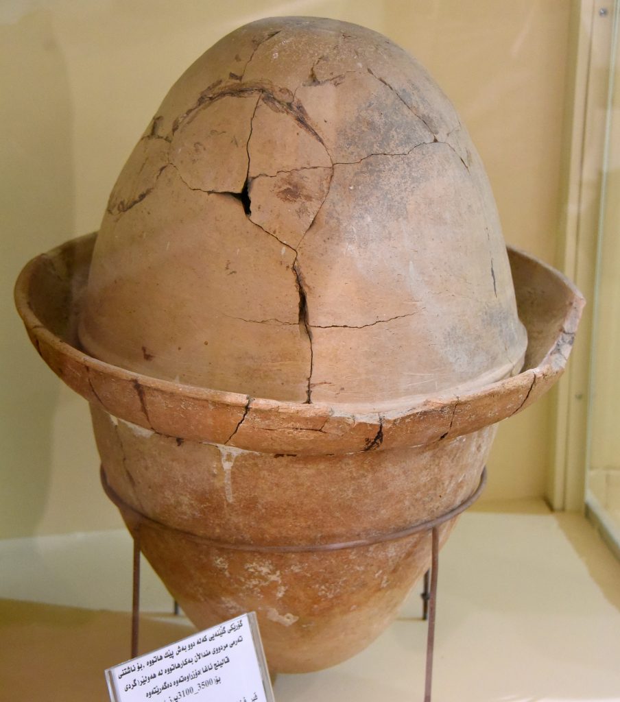 Pottery tomb in the shape of an egg. Such tombs were used for deceased children burials. From Tell Qaling Agha, Erbil City, Iraqi Kurdistan. Circa 3500-3100 BCE. Erbil Civilization Museum, Iraqi Kurdistan. Photo © Osama S. M. Amin.