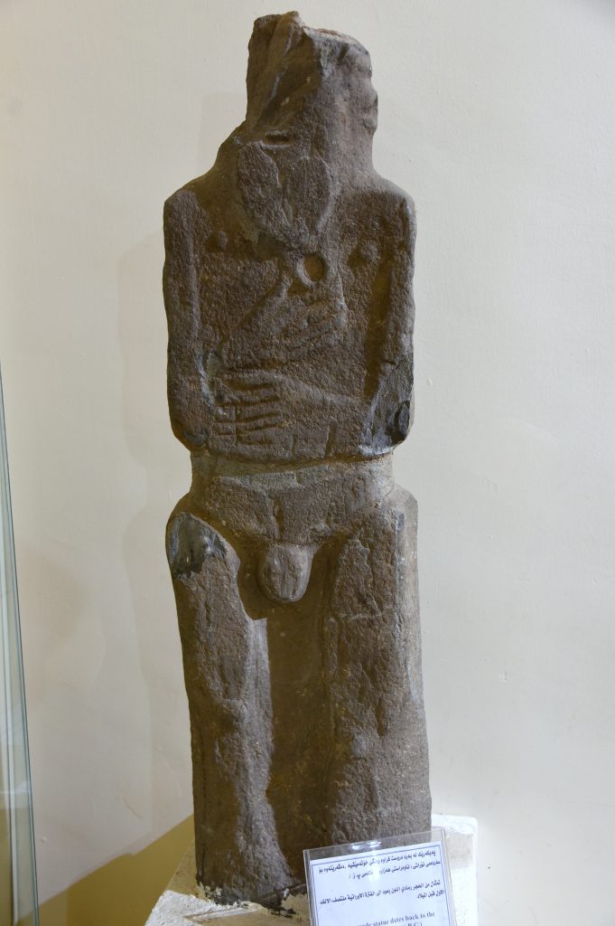 Sandstone statue of an unknown standing and naked man or deity. From modern-day southern Kurdistan, Iraq; precise provenance of excavation is unknown. Urartian period, mid-first millennium BCE. Erbil Civilization Museum, Iraqi Kurdistan. Photo © Osama S. M. Amin.