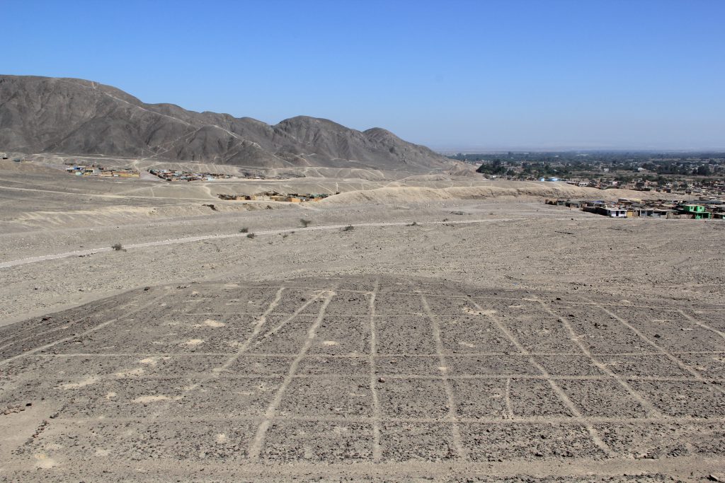 An ancient grid created from the stones in the desert. Image © Caroline Cervera. Nazca lines