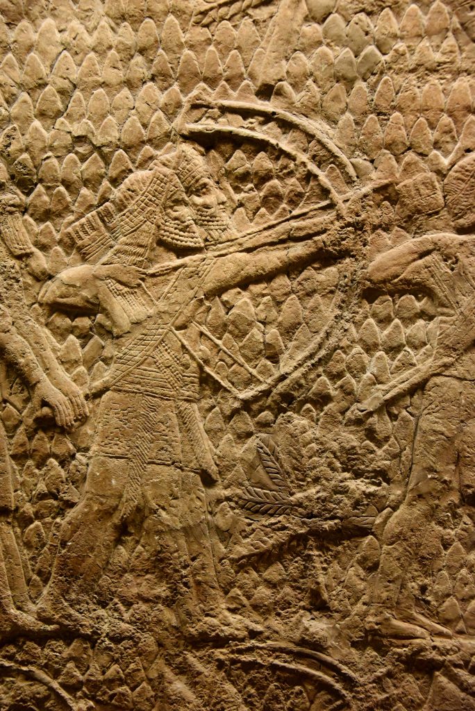 The beginning of the attack on Lachish in 701 BCE. This is a detail of a large stone wall panel which shows that Assyrian archers (part of a large-range artillery, not shown here) are shooting swift arrows with their large bows, aiming at the enemy soldiers, defending the city walls' towers. The archers stand before siege engines (not shown here). From Nineveh (modern-day Mosul Governorate, Iraq), Room XXXVI of the South-West Palace, panels 5-6. The British Museum, London. Photo © Osama S. M. Amin.