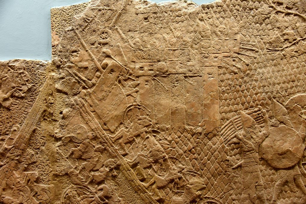 The Assyrian army is crushing the enemy and has reached the city wall. The soldiers of Lachish are still within their protective towers. From Nineveh (modern-day Mosul Governorate, Iraq), Room XXXVI of the South-West Palace, panel 7. The British Museum, London. Photo © Osama S. M. Amin. 