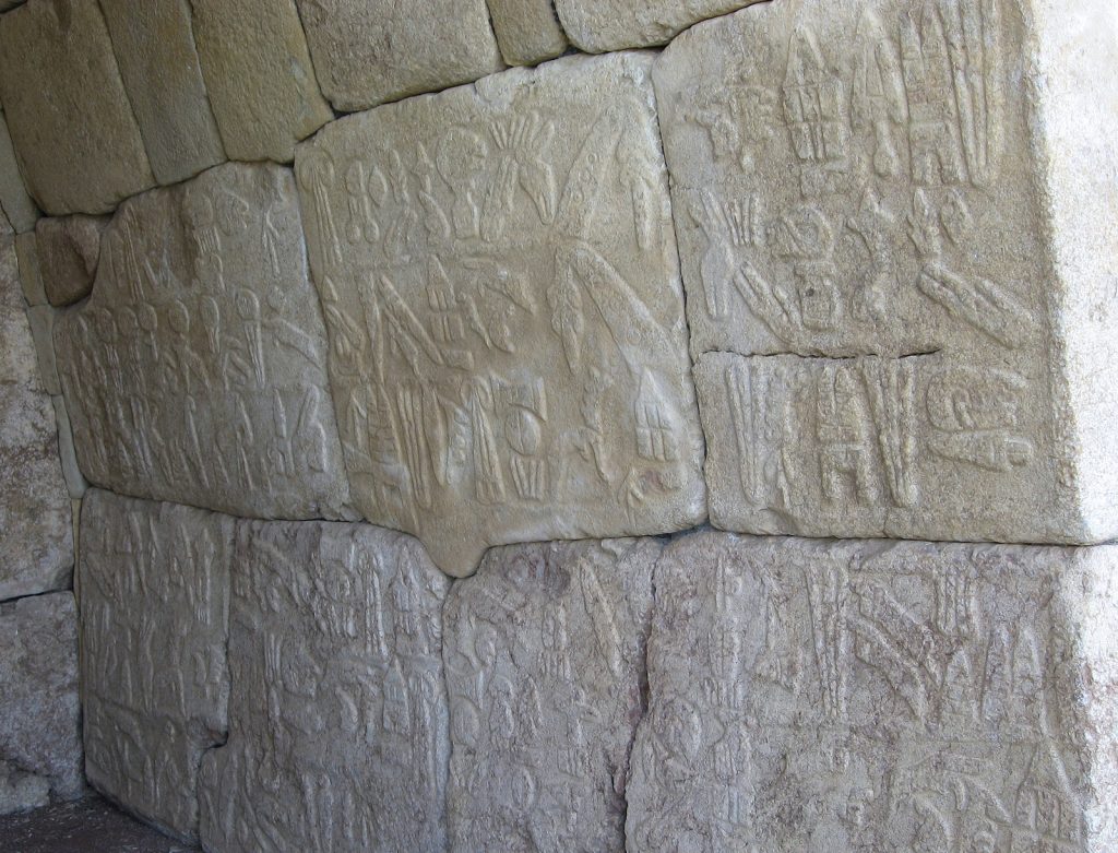 The six-line Luwian hieroglyphs inscription commissioned by the Great King Suppiluliuma II on the right-hand wall of the chamber. The text describes the invasions and successes of King Suppiluliuma II, mentioning that with the help of the gods, the King invaded several lands, including that of Tarhuntassa. Hittite