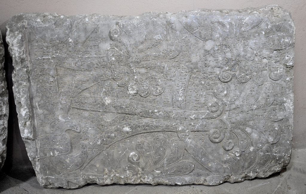 This fragment of a wall relief from the North-West Palace of Ashurnasirpal II at Nimrud shows parts of a sacred tree or tree of life. The tree is covered by the "Standard Inscription" of Ashurnasirpal II. Not on display. Exclusive photo; never-before-published. The Sulaymaniyah Museum, Iraqi Kurdistan. Photo © Osama S. M. Amin. 